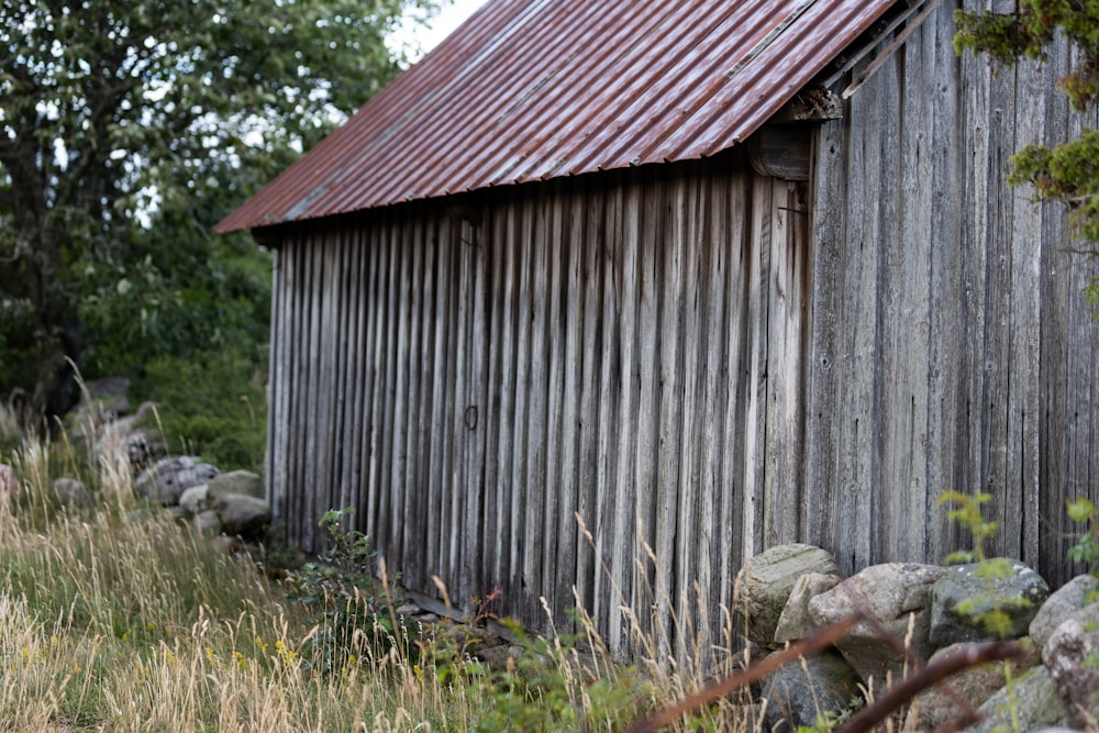 an old barn with a rusty tin roof