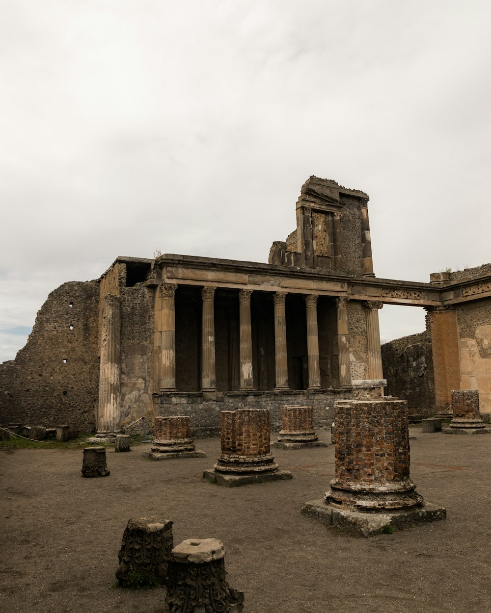 an old building with columns and a clock tower