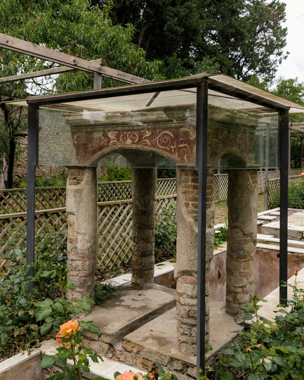 a stone structure with a painting on the side of it