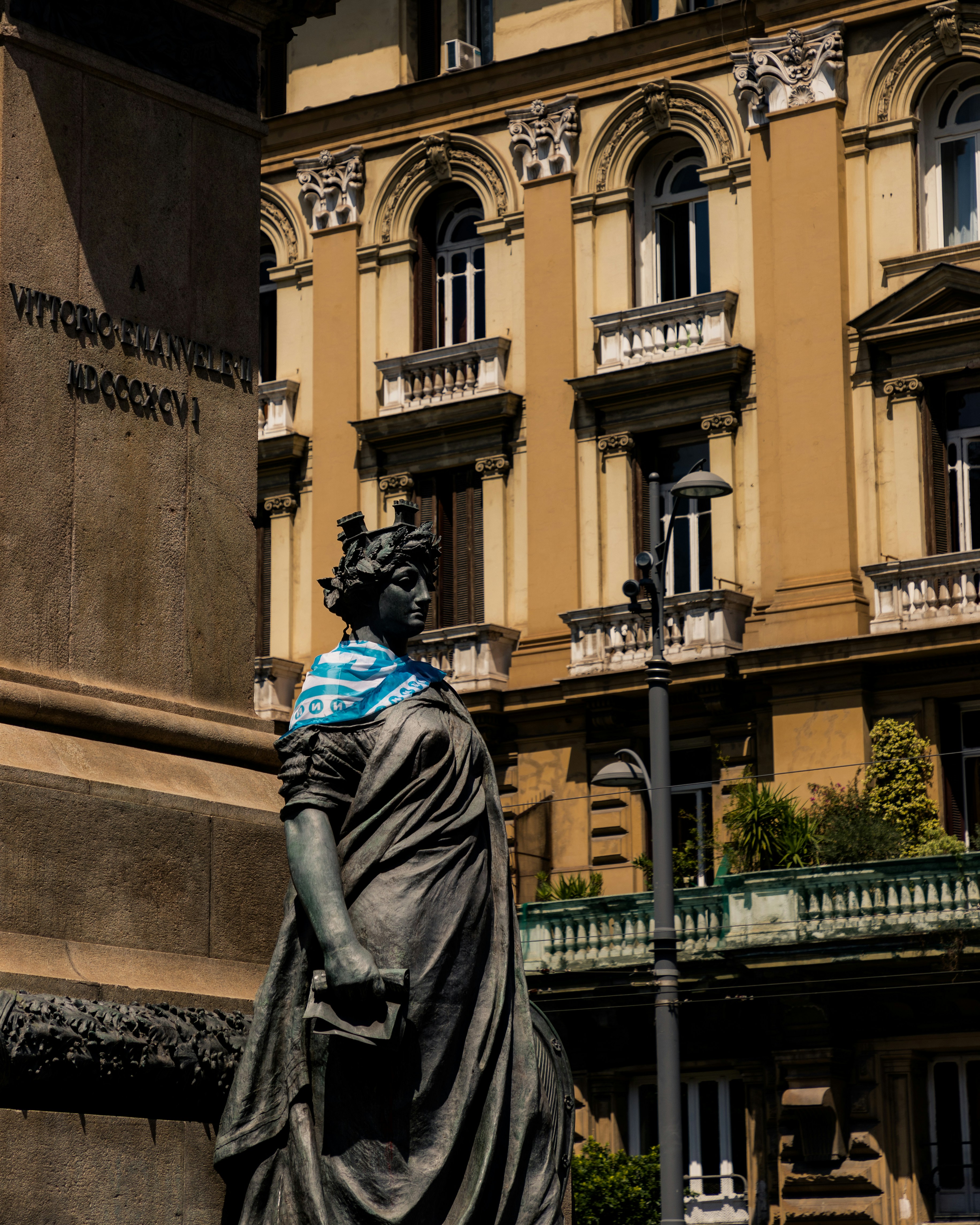 a statue of a woman in front of a building