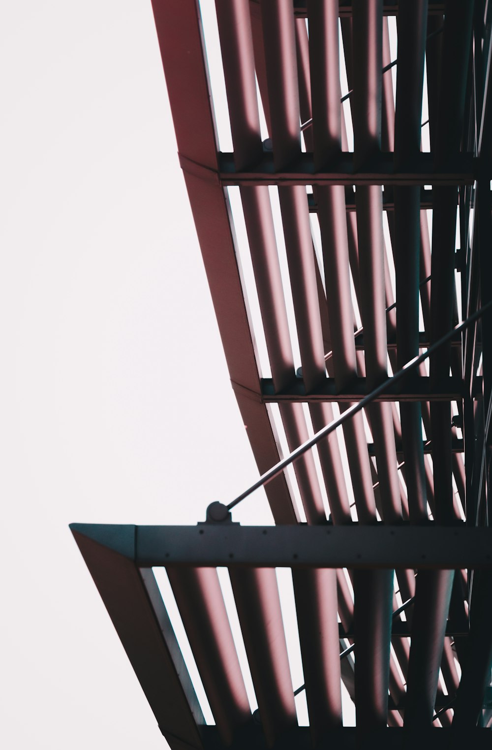 a close up of a metal structure with a sky background