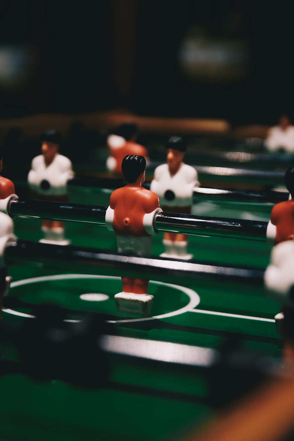 a close up of a foosball table with many figurines on it