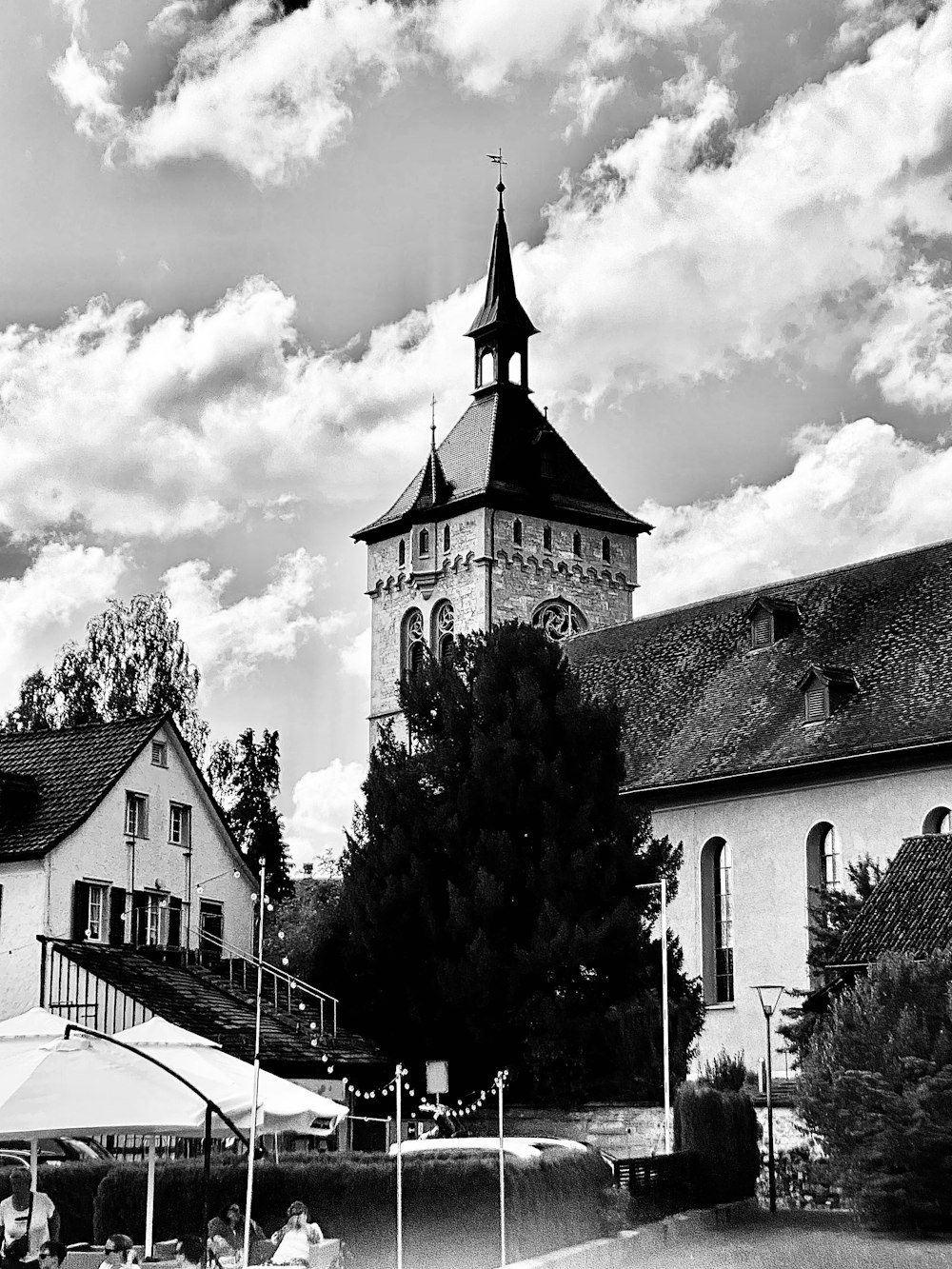 a black and white photo of a building with a clock tower