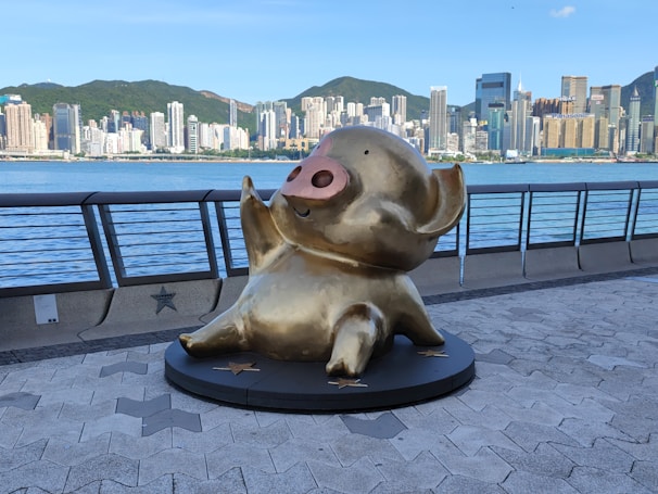 An artistic depiction of pigs exploring iconic NYC landmarks.