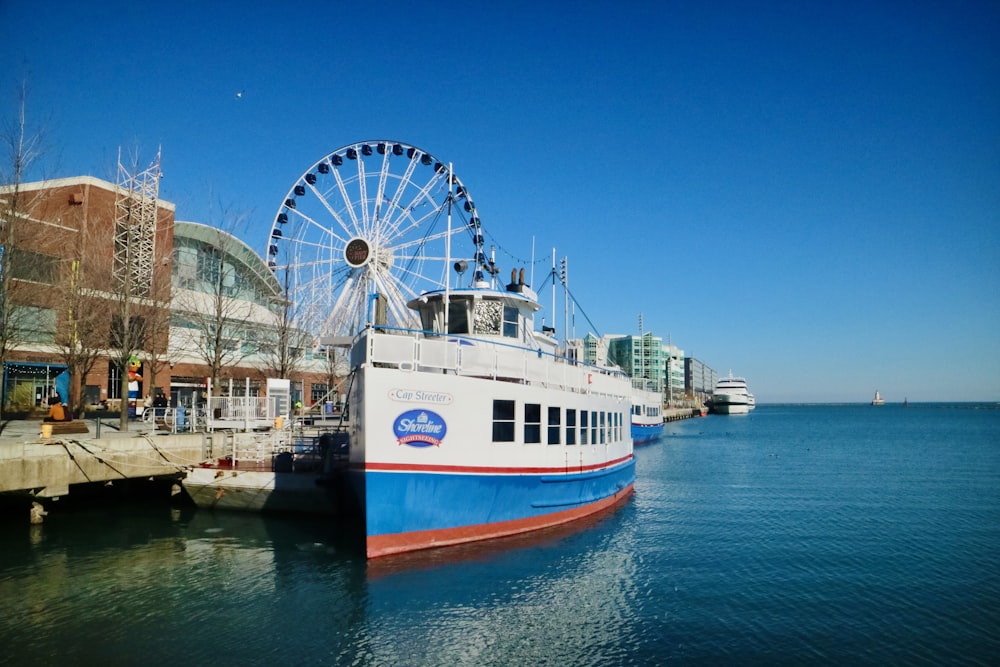 a large white and blue boat in a body of water