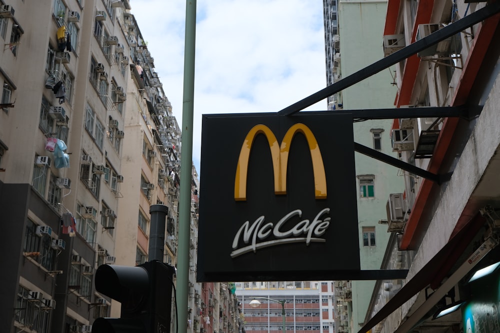 a mcdonald's sign hanging off the side of a building