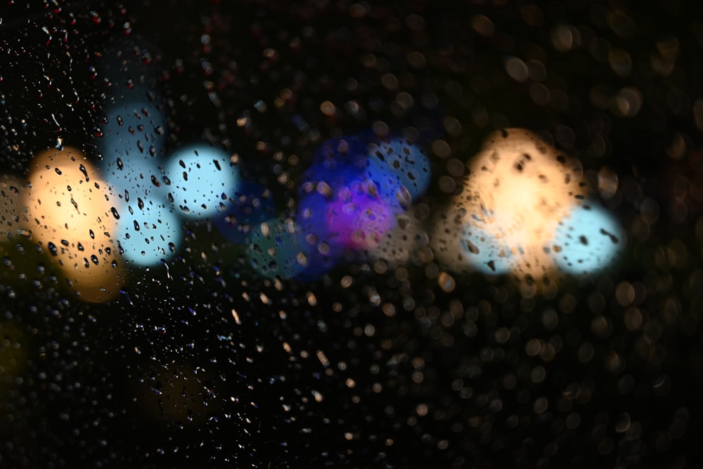 a blurry photo of a rain covered window