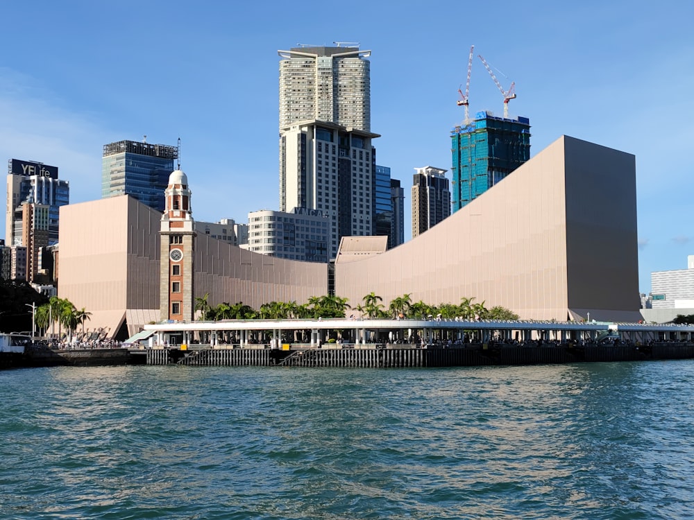 a body of water with a city in the background