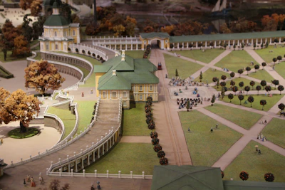 A detailed 3D model of a landscaped garden featuring pathways, plants, and water features.