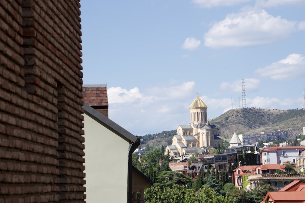 a view of a city with a church in the background