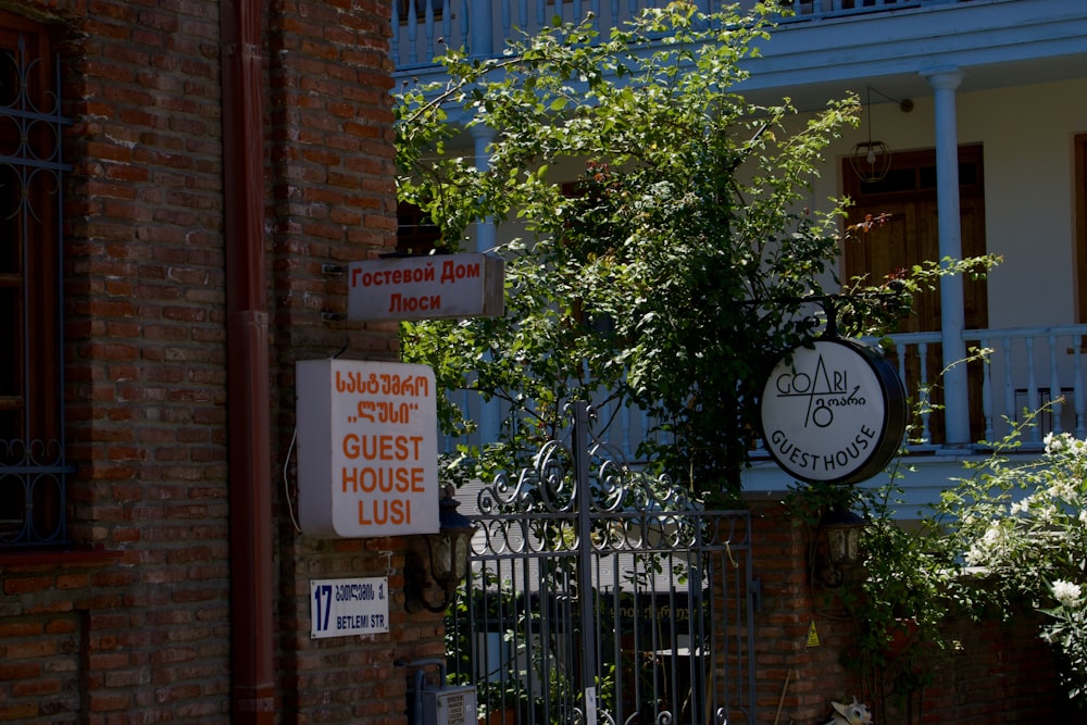 a brick building with a sign on the front of it