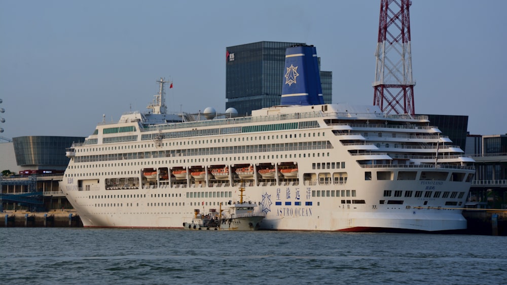 a large cruise ship docked in a harbor