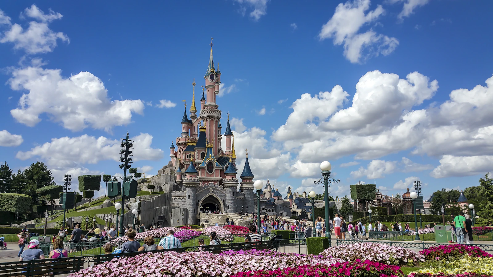 Guests outside Sleeping Beauty Castle at Disneyland Paris