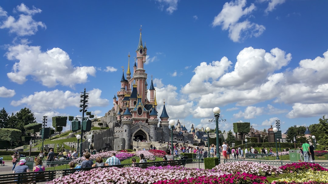 a castle with a lot of people around it,