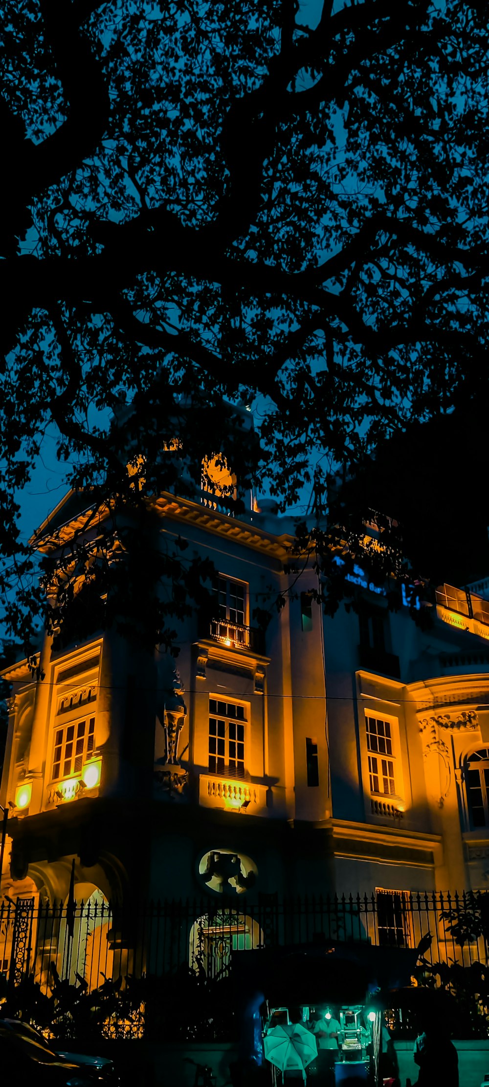 a large white building with a clock on the front of it