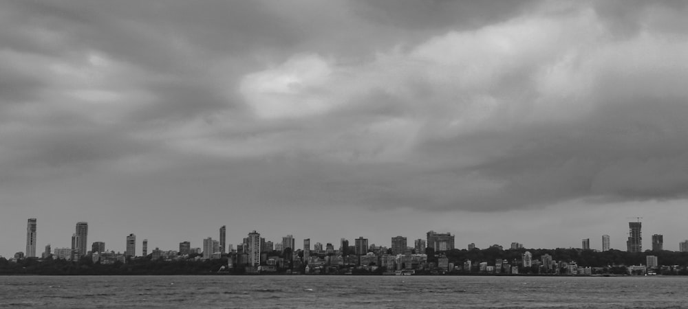 a large body of water with a city in the background