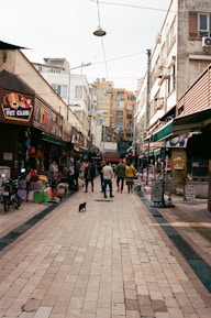 Ziv Katina exploring a vibrant street market during her travels.