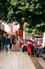 A vibrant street scene in Sakarya with people enjoying local cafes and shops.