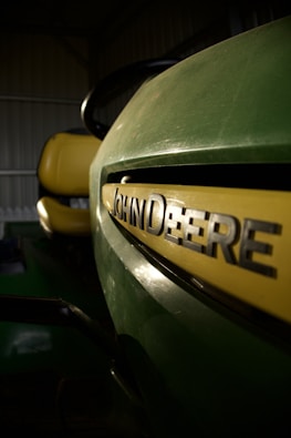 a close up of a green and yellow vehicle