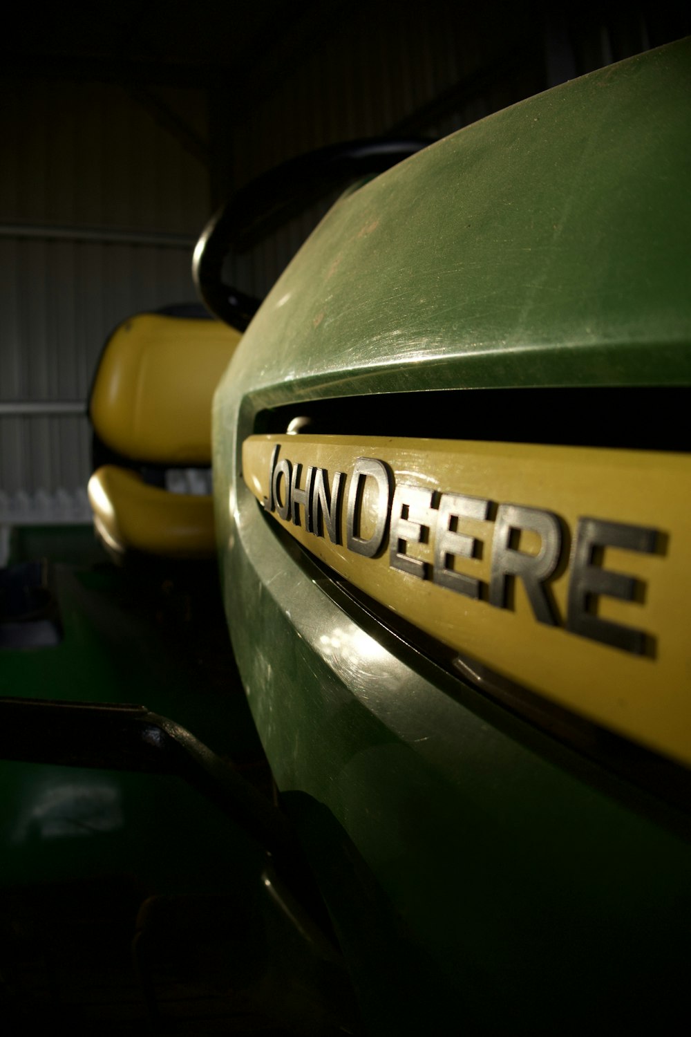 a close up of a green and yellow vehicle