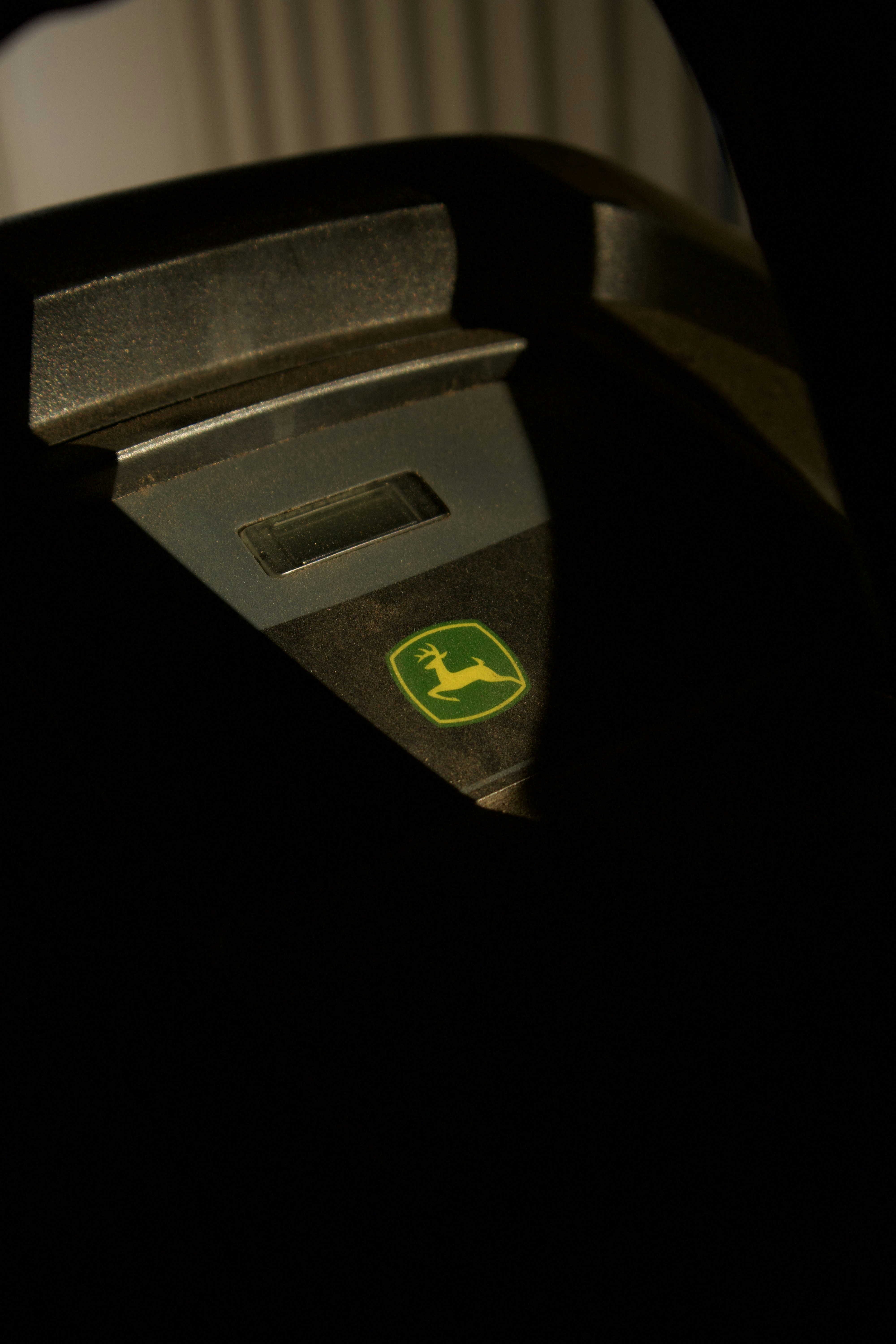 a close up of a parking meter in the dark