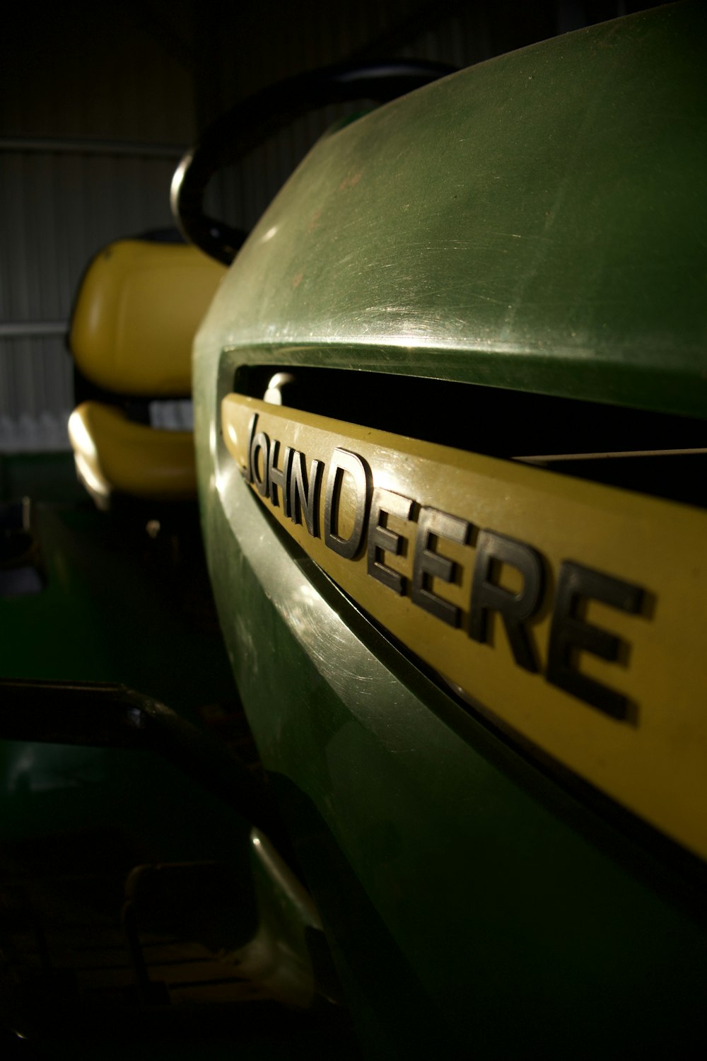 a close up of a green and yellow vehicle