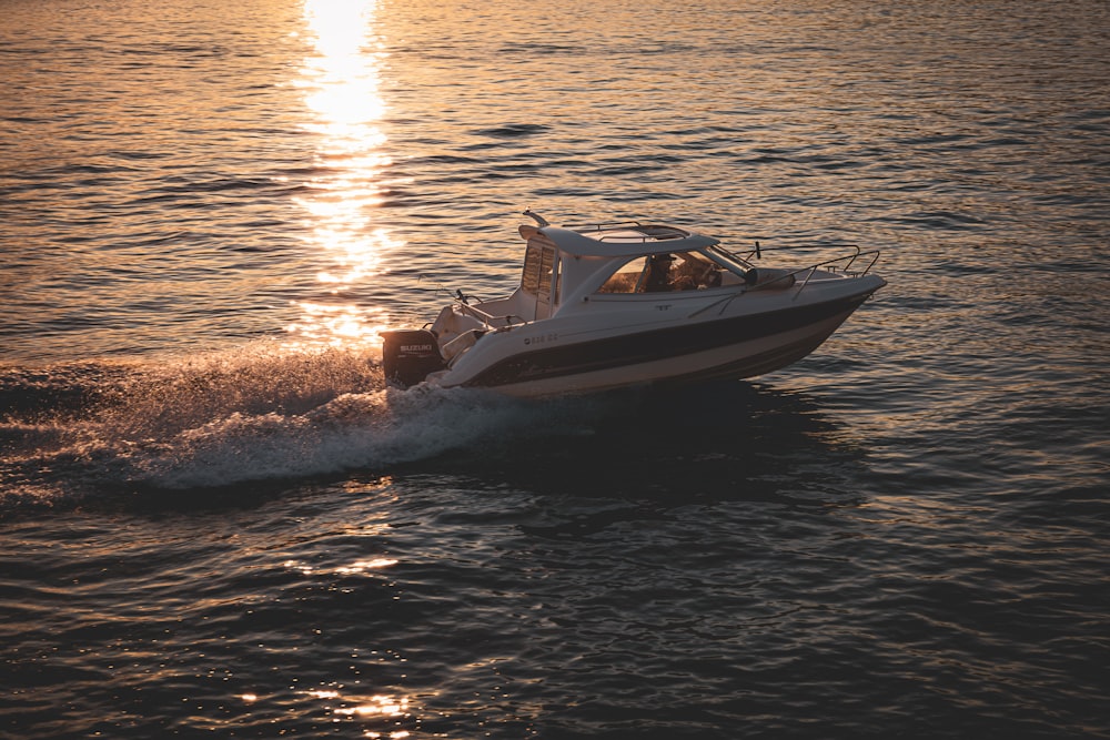 a small boat traveling across a large body of water