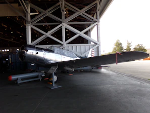 Completed wing section with control surfaces attached, resting in the hangar