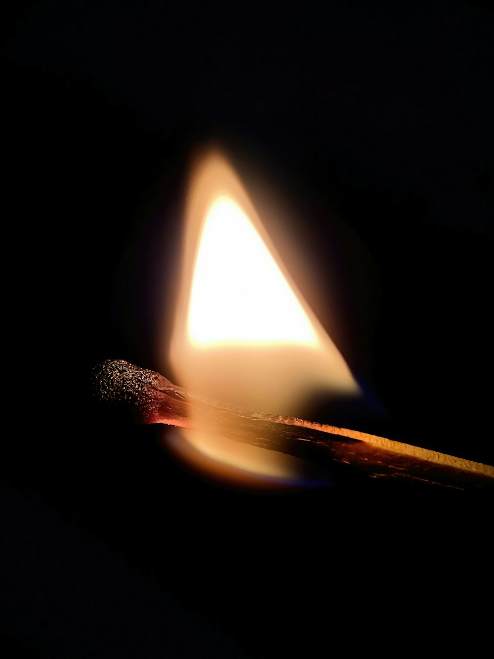 a lit matchstick sitting on top of a table