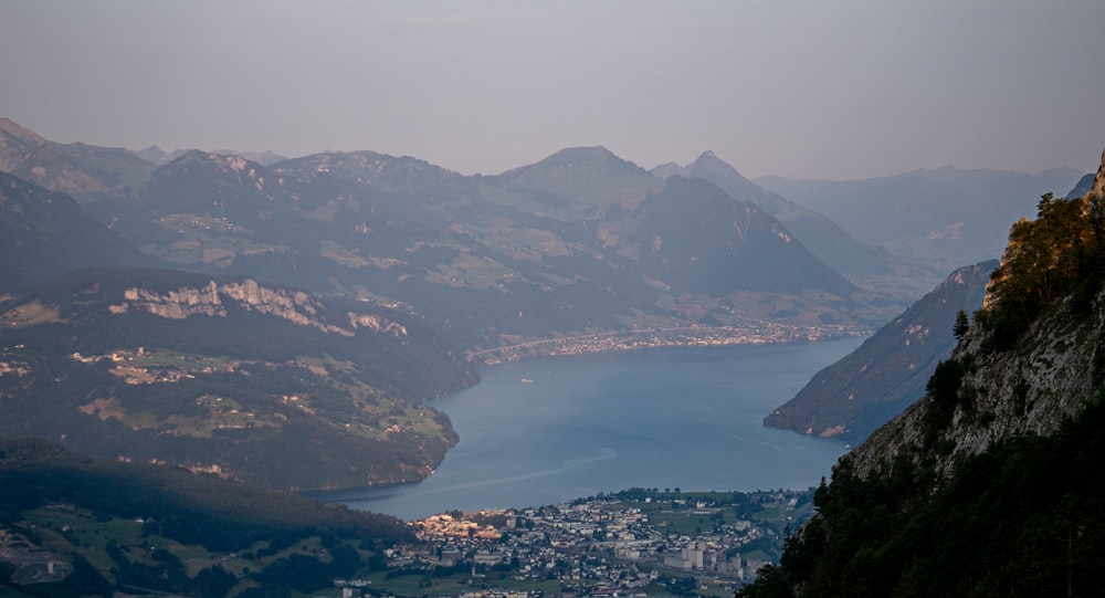 a view of a lake and mountains from a high point of view