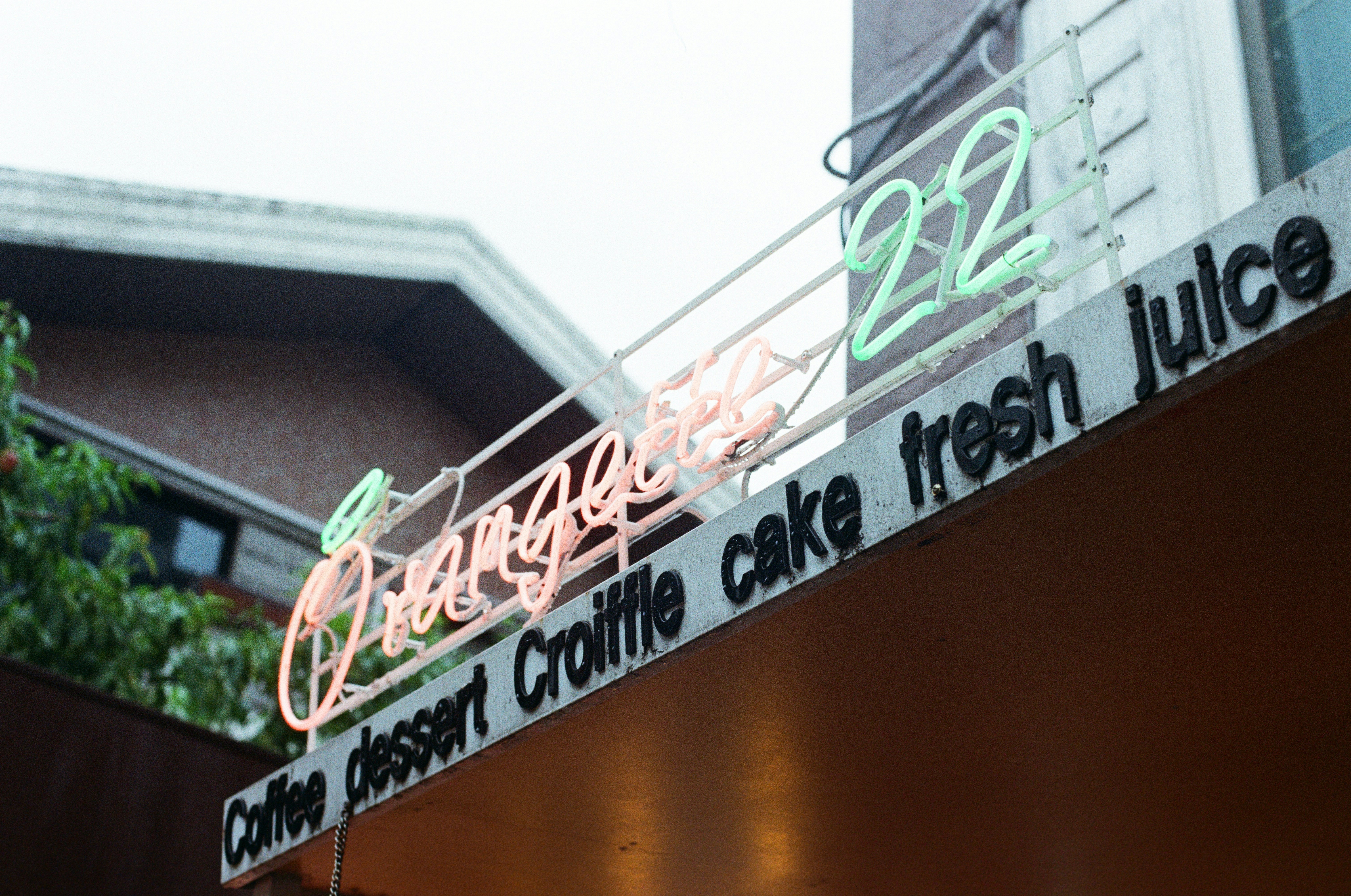 a close up of a neon sign on a building
