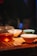 A beautifully arranged tea set on a wooden table with natural lighting.