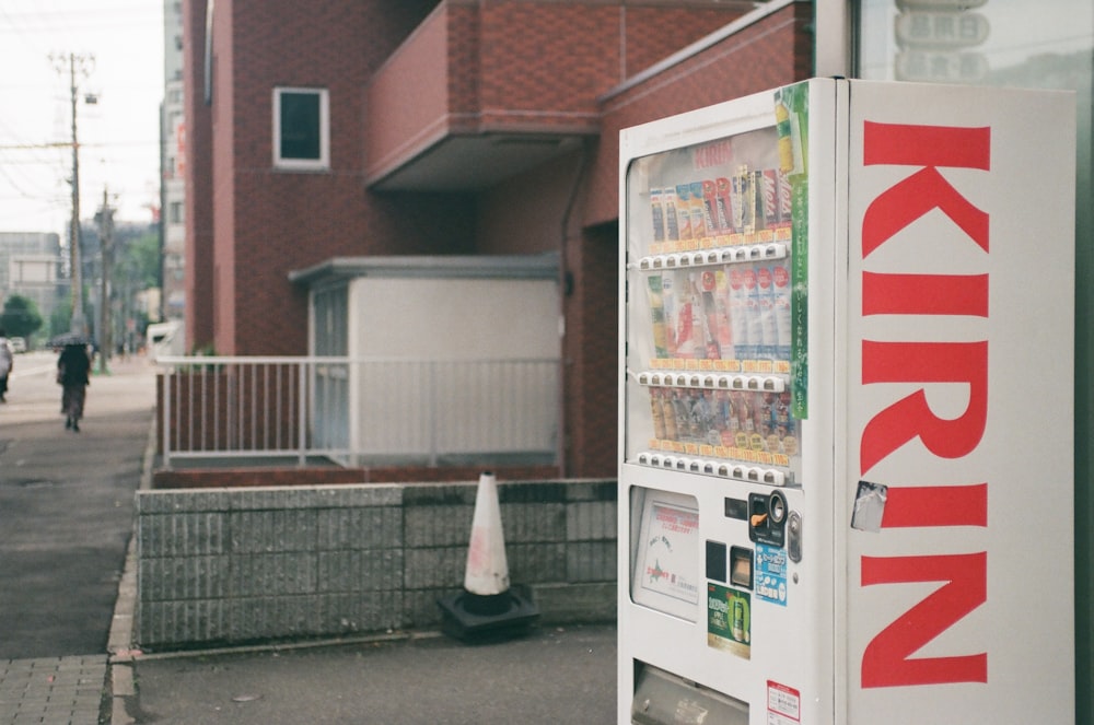 a vending machine sitting on the side of a road