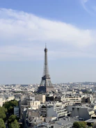 A sleek dashboard displaying real-time cloud infrastructure metrics with a Paris cityscape in the background.