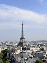 A vibrant collage of famous landmarks like the Eiffel Tower, Great Wall of China, and Machu Picchu under a bright blue sky.