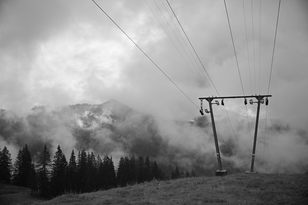 a black and white photo of a ski lift