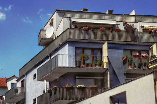 Apartment building in Cholula with balconies and street view.