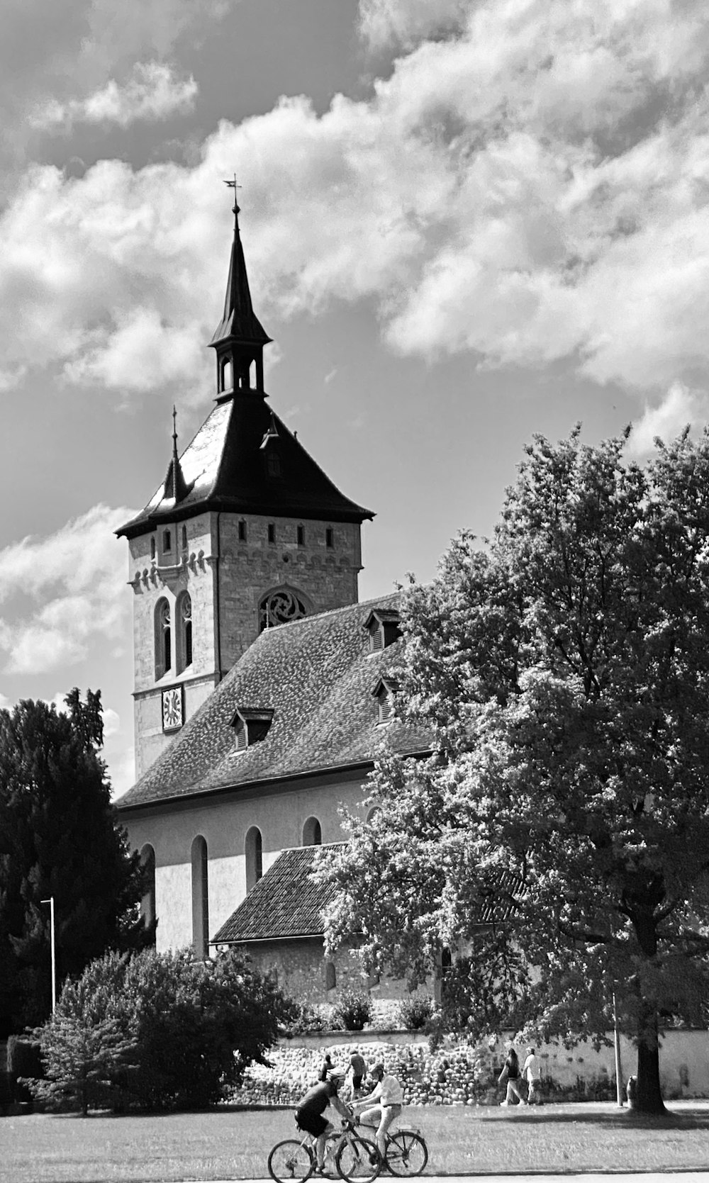 a black and white photo of a building with a clock tower