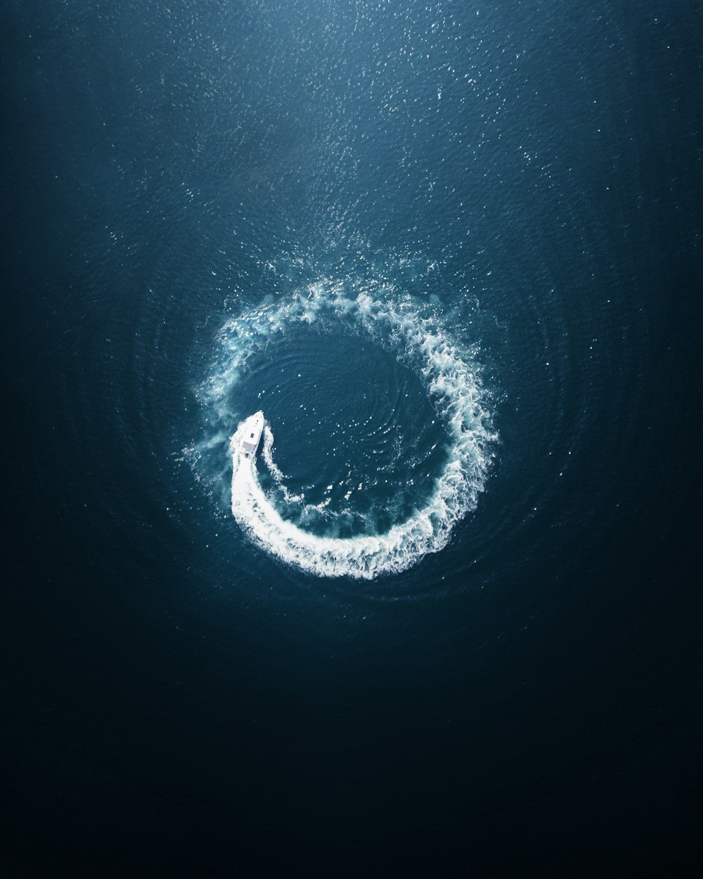a circular object floating in the middle of the ocean