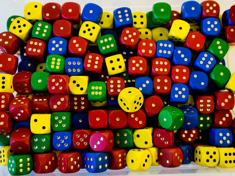 a pile of colorful dices stacked on top of each other