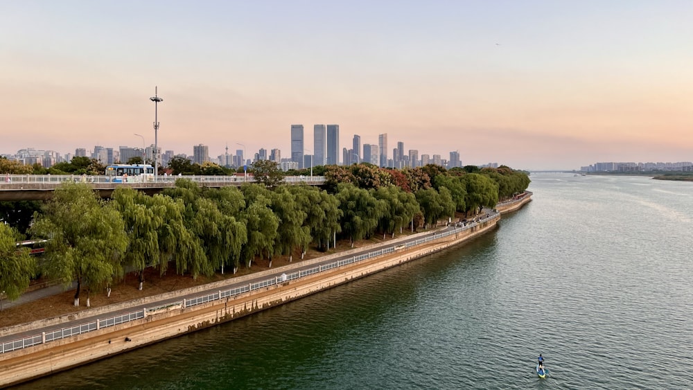 a body of water with a city in the background