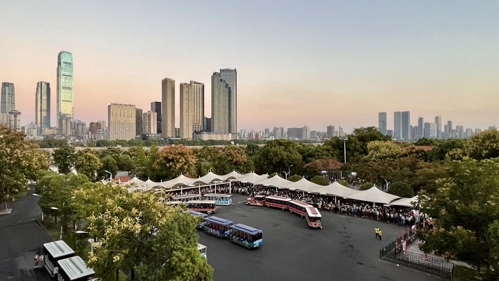 a parking lot with a lot of buses parked in it