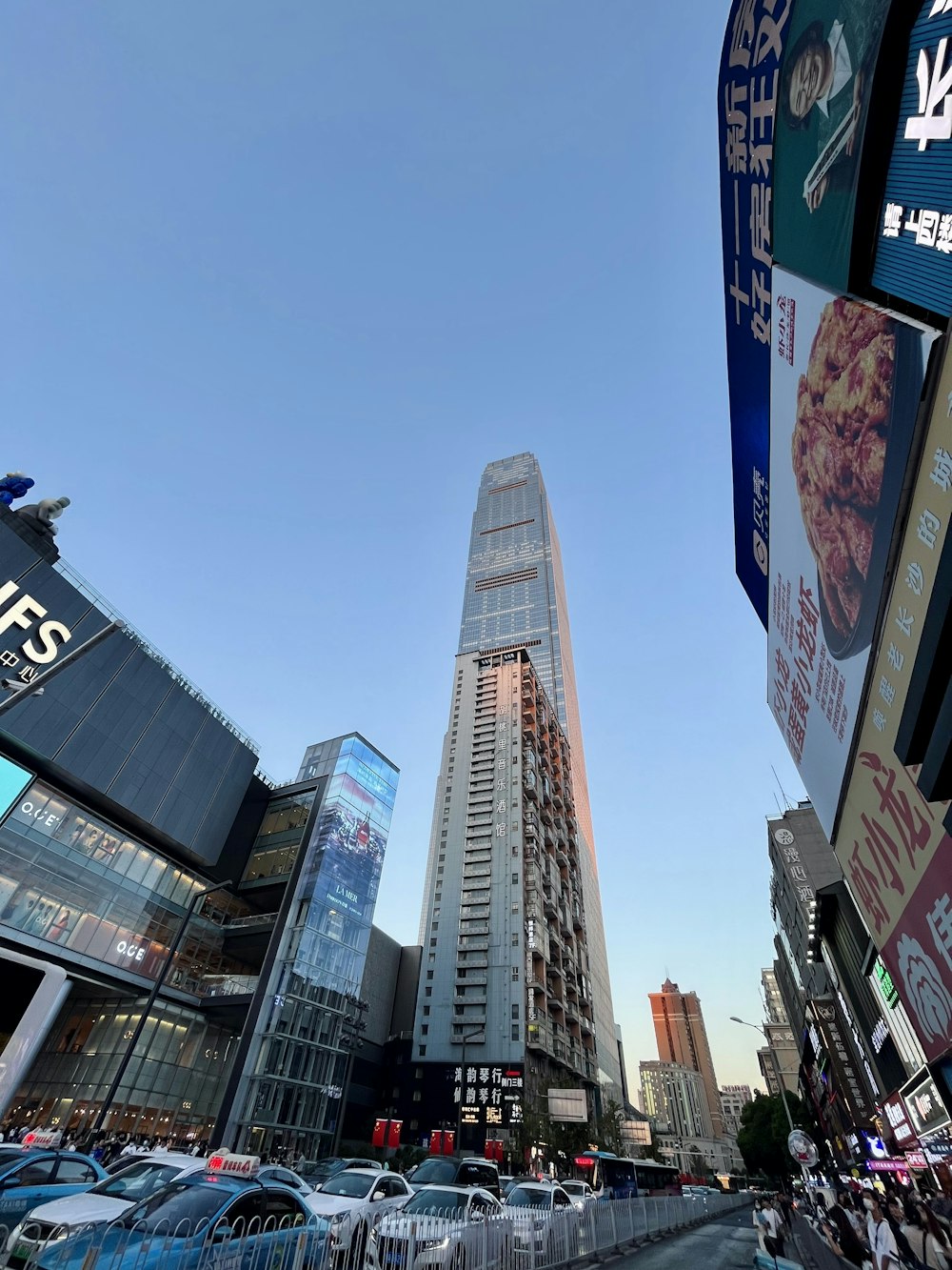 a city street filled with lots of tall buildings