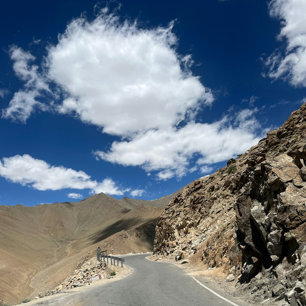 a road with a mountain in the background