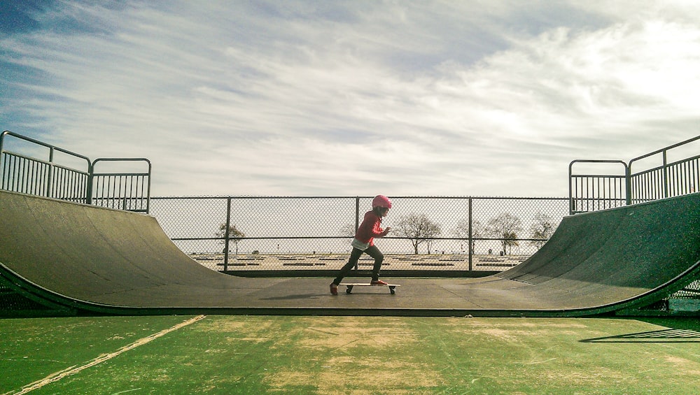 a man riding a skateboard up the side of a ramp