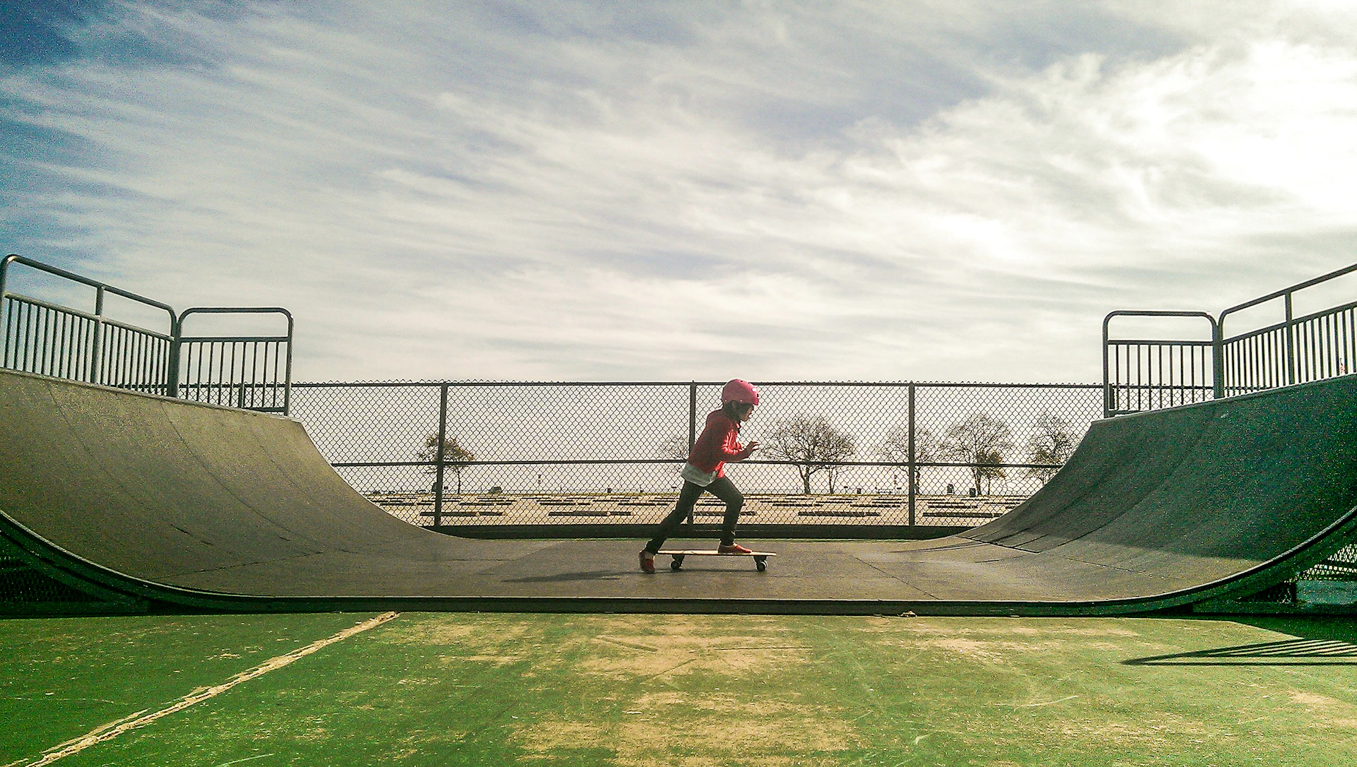 a man riding a skateboard up the side of a ramp