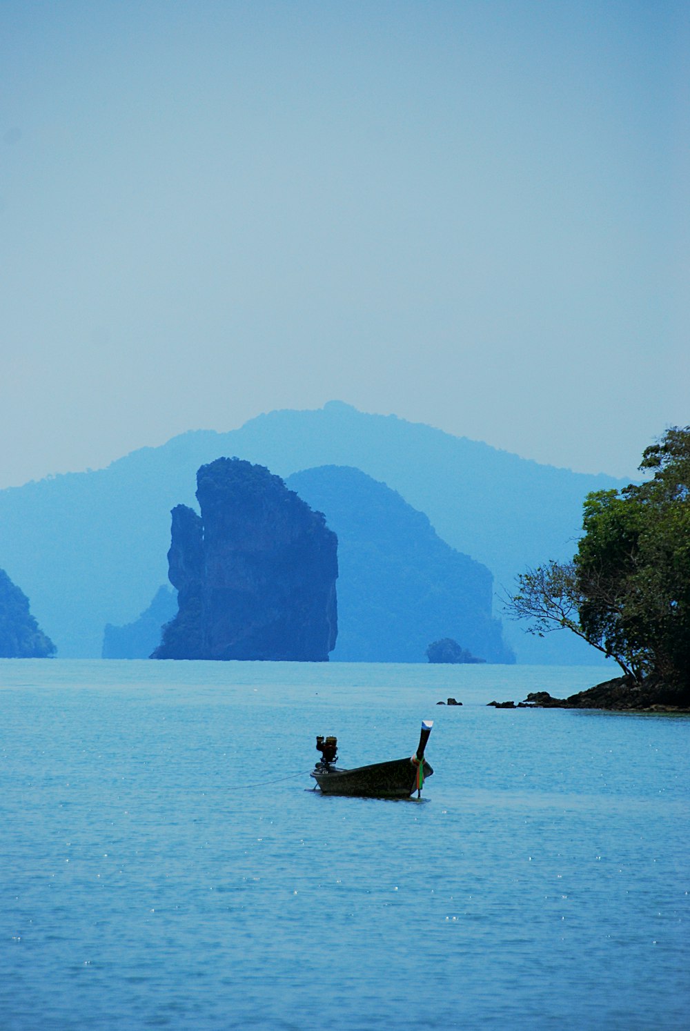 a boat floating on top of a large body of water