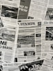 The image contains a collage of various international newspaper front pages, featuring headlines and images related to global news events. The papers have sections in different languages such as English, Italian, and Hebrew. Prominent topics include political issues and events, with accompanying black-and-white photographs.
