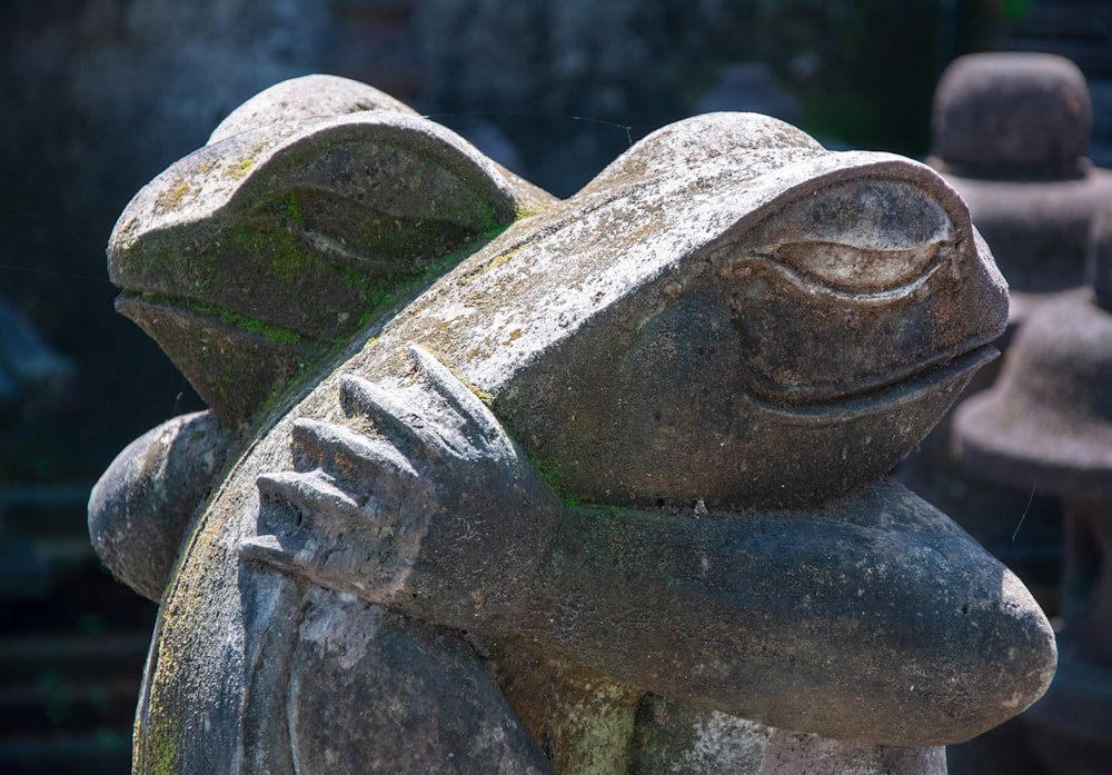 a close up of a statue of a frog