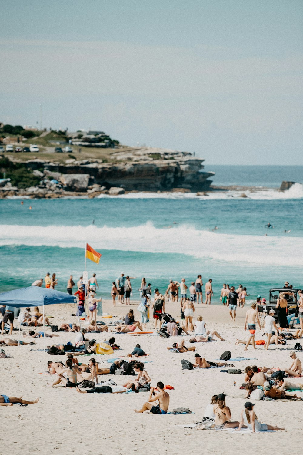 a large group of people on a beach